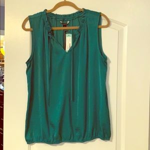 Green sleeveless blouse